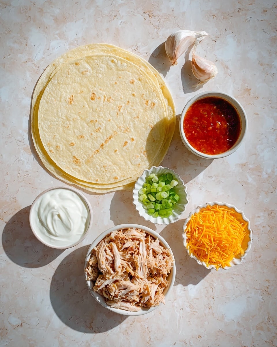 Two soft pale yellow tortillas lie flat on a white marbled surface in the top half of the image. Below them, in five small white bowls arranged closely, are different ingredients: shredded light brown cooked meat fills the biggest bowl in the center, bright orange shredded cheese sits in a bowl to the lower right, thick white sour cream fills the bowl to the lower left, chopped green onions with a mix of light and dark green color are in a small bowl above the cheese, and a red sauce fills a scalloped bowl above the sour cream. Two garlic cloves rest on the white marbled surface near the bowl with meat. The scene is lit with natural light creating soft shadows. Photo taken with an iphone --ar 4:5 --v 7